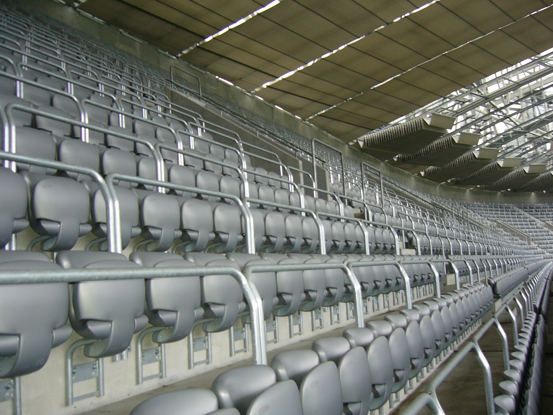 Rows of empty gray stadium seats