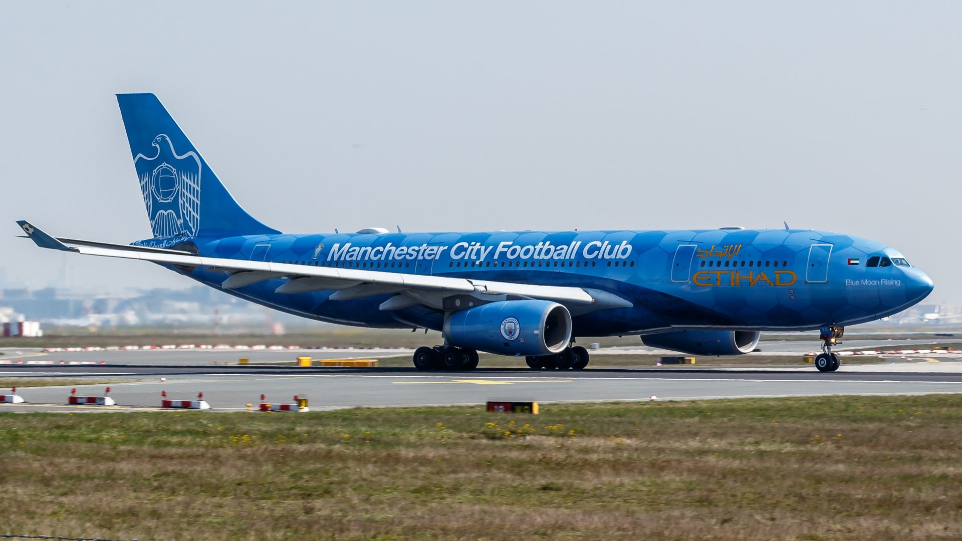 An Etihad Airways Airbus A330 painted in Manchester City colours taxiing at Frankfurt Airport