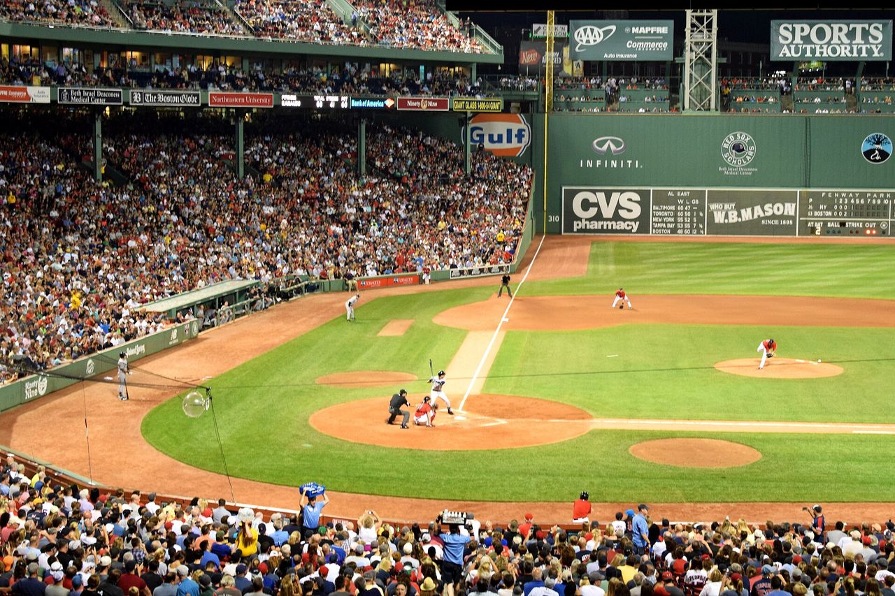 Fenway Park glowing at night during a game